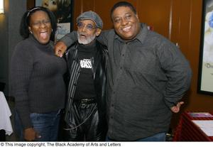 [Photograph of Melvin Van Peebles posing with a man and a woman, 3]