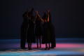 Photograph: [Photograph of dancers holding hands in a circle]