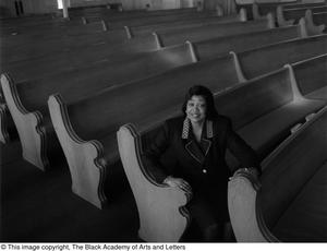 [Dorothy N. Cole Davis seated among the pews of a church #2]