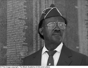 [Willie Parker standing in front of War memorial, 2]