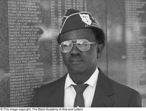 [Willie Parker standing in front of War memorial, 4]