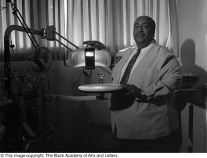 [Photograph of Dr. Strotha E. Hardeman, Jr. standing in his dental office #2]