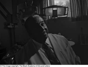 [Photograph of Dr. Strotha E. Hardeman, Jr. in his dental exam room]