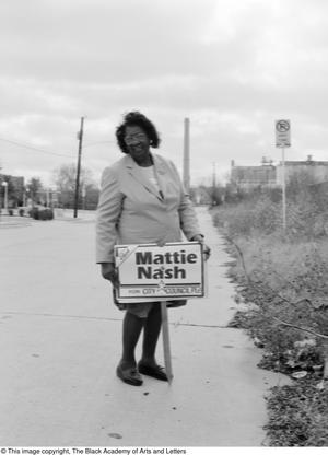 [Mattie Nash holding campaign sign, 2]