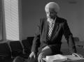 Photograph: [Photograph of J. B. Jackson in conference room]