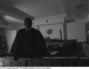 [Judge L. Clifford Davis posing for portrait in courtroom]
