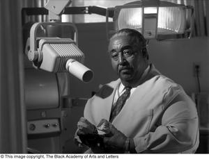 [Photograph of Dr. Strotha E. Hardeman, Jr. and his dental equipment]