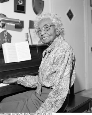 [Photograph of Marjorie Jackson seated at her piano #2]