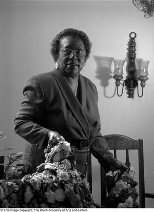 Primary view of object titled '[Photograph of Althea Jones Hilliard holding her quilt]'.