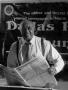 Photograph: [Samuel Wicks holding The Dallas Post Tribune #2]