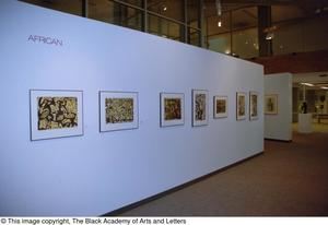 [Photograph of an African gallery wall, featuring seven abstract art works]