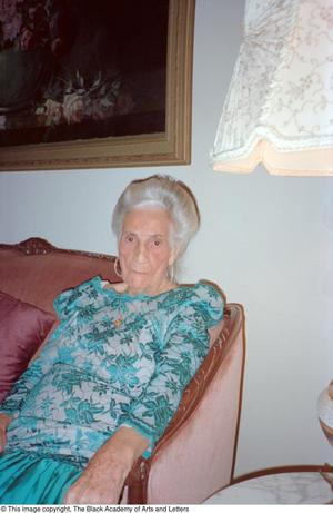 [Photograph of Pearl C. Anderson in her living room]