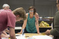Thumbnail image of item number 1 in: '[Courtney Jacobs and participants at printing station]'.