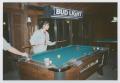 Photograph: [Photograph of a female TAMS student playing pool]