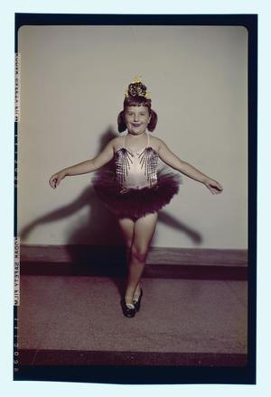 [Young girl in a ballet outfit]