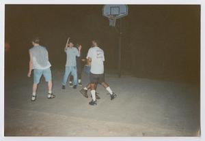 [Photograph of TAMS students playing basketball]