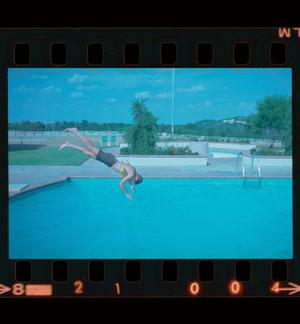 [Photograph of a boy diving into a pool, 2]