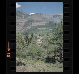 [Photograph of a small town in a valley]