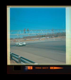 Primary view of object titled '[Photograph of two individuals on a bridge at Green Valley Raceway]'.