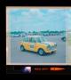 Thumbnail image of item number 1 in: '[Photograph of a yellow race car at Green Valley Raceway]'.