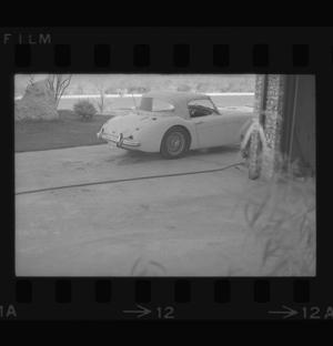 [Photograph of an automobile in a driveway]