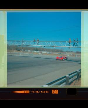 Primary view of object titled '[Photograph of five individuals on a bridge at Green Valley Raceway]'.