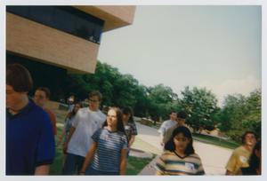 [Photograph of TAMS students walking by the GAB building]