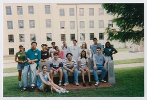 [Photograph of TAMS students on a memorial bench]