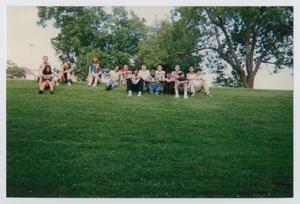[Photograph of TAMS group on grass field]