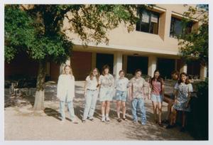 [Photograph of TAMS students in front of campus building]