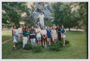 [Photograph of TAMS group in front of statue]