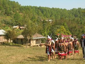 Leigpungtampak dancers coming towards the playground to perform the dance