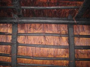 Photograph of a wooden house inner roof chained thatch by cane [Trii-ngi-tcheen]