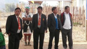 Motit Dilbung in tradtional attire, with Semler Suungnem, Rocky Shilshi and two elders.