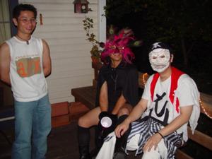 [Halloween party guests on the porch]