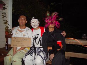 Primary view of object titled '[Guests sitting on bench at Halloween party]'.