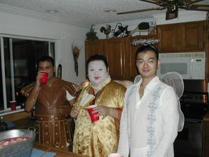 [Halloween guests dressed as a Roman soldier, an emperor, and an angel]