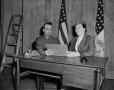 Photograph: [Jett Jamison and a woman at a desk]