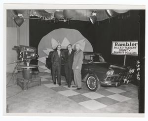 [Men in front of a Rambler on the WBAP-TV set]