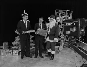 [Larry Morrell and Santa Claus on set]