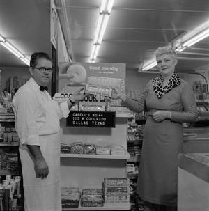 [Man and woman in front of a store display at Cabell's]