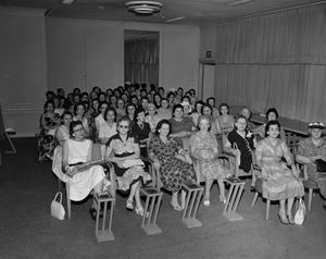 [Large group of women sitting]