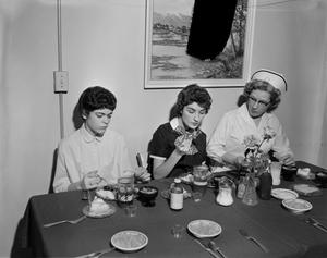 [Three women eating]