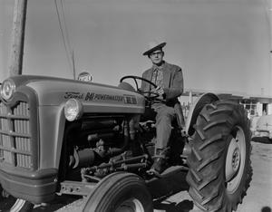 [Calvin Pigg on a Ford tractor]