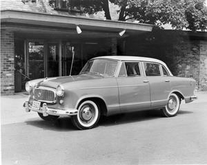[American Rambler in front of a building]