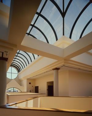 [Photograph of a building interior with curved skylights]