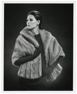 [Photograph of a model dressed in a fur coat]