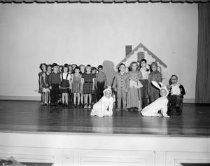 [Students on stage at S.S. Dillo School]
