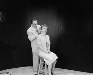 [Photograph of Vernon Isbell and model]