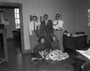 [Robert Gould with members next to Christmas tree]